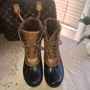 Great condition. Fleece lined. Dark blue,brown